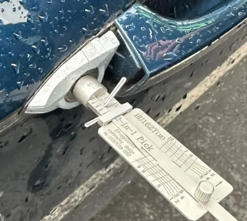 Retrieving keys locked inside the boot of a saloon vehicle using non-destructive auto locksmith entry methods in Leeds.