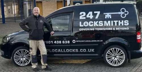 Commercial Locksmith Leeds - Trusted Business Security & Lock Services Local commercial locksmith Mark standing next to the 247Locksmiths mobile van, providing business security services in Leeds.