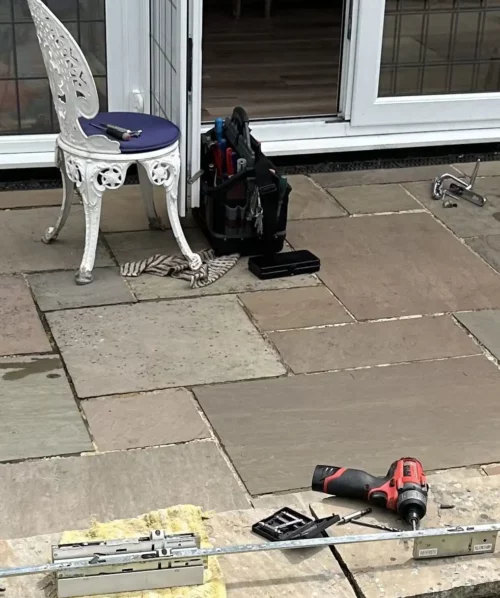 Expert uPVC door repair in Leeds showing a locksmith servicing a multi-point locking mechanism.
