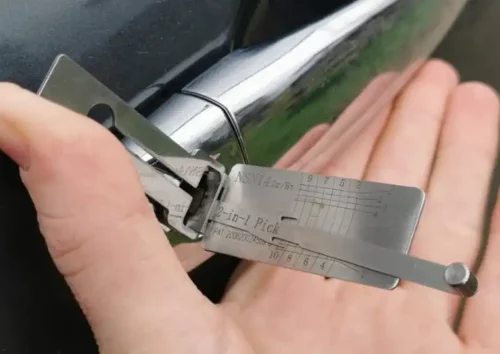 An auto locksmith specialist using precision tools to perform a damage-free vehicle opening during a car lockout in Otley.