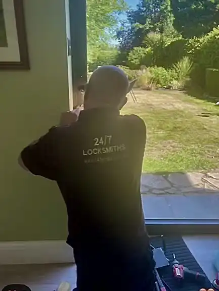 Mark from 247Locksmiths repairing a complex bi-fold door locking system in Alwoodley, Leeds.