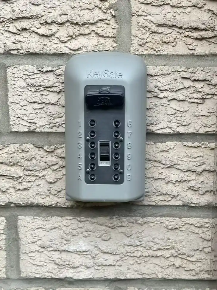 A heavy-duty Supra C500 key safe professionally mounted to an external brick wall using heavy-duty masonry anchors in Leeds.